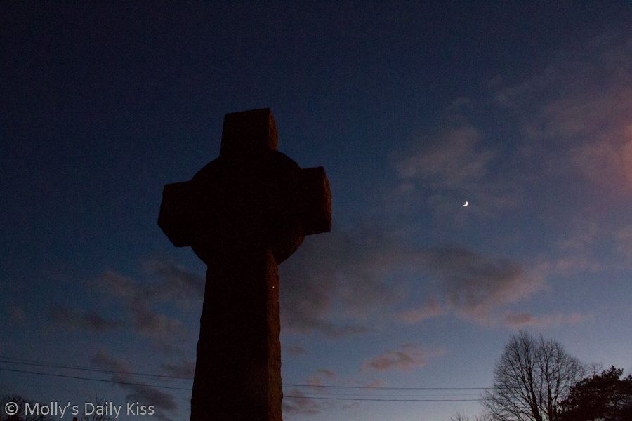 Church cross in the moonlight